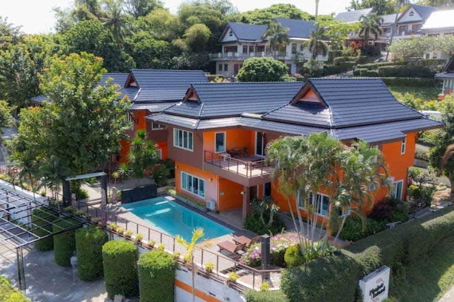 Aerial perspective of a house with a pool, highlighting the tranquil environment of rehab Thailand.