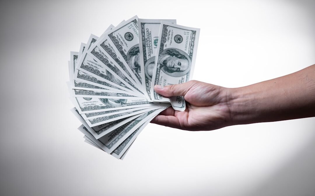 person with money - How Much Does Alcohol Rehab Cost
